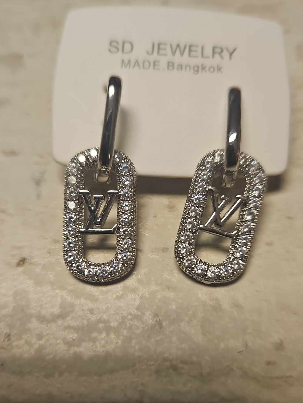SD Jewelry Silver Crystal Drop Earrings with Icon Accent